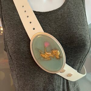 White leather belt with whimsical Cupid acrylic design buckle in gold and aqua